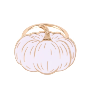 Golden Halloween pumpkin napkin ring with white enamel detail on white background