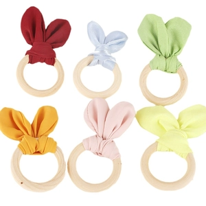 Easter bunny ear napkin rings set made of natural wood and soft fabric in six pastel colors