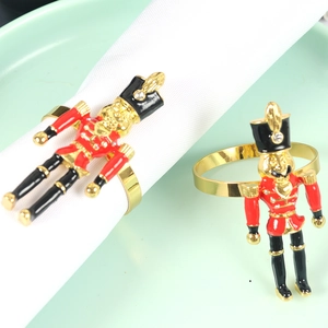 Nutcracker soldier napkin rings with red and gold enamel finish and rhinestone details