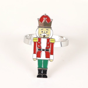 Detailed close-up of a silver nutcracker soldier napkin ring with enamel finish