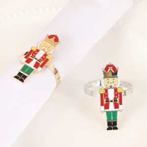 Nutcracker napkin rings with festive red and green soldier figures in gold and silver finish