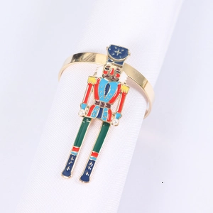 Detail showing Nutcracker soldier napkin ring with colorful enamel and pearl accents