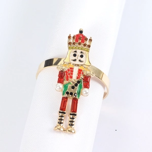 Nutcracker king napkin ring with colorful enamel and pearls for holiday table setting