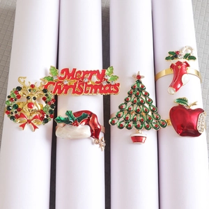 Christmas napkin ring set with colorful enamel elk tree and wreath motifs in gold