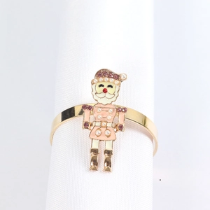Golden Nutcracker napkin ring with pink jewels and pearls for Christmas table setting decoration
