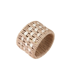Handwoven bicolor linen and rope napkin ring with rustic texture for hotel table setting