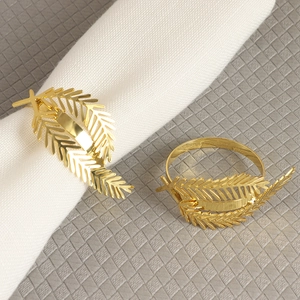Golden hollow leaf metal napkin ring set for elegant wedding or dinner table decor
