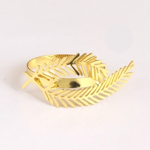 Elegant gold metal hollow leaf napkin ring with polished finish for table setting decoration