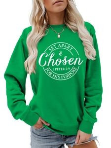 Close-up of ribbed cuffs and white circular spiritual print on green casual sweatshirt