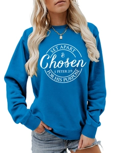 Detail of blue crewneck sweatshirt with white SET APART & CHOSEN religious graphic print