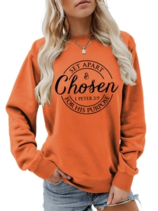 Detail of orange long-sleeve sweatshirt with black 1 Peter 2:9 biblical print text