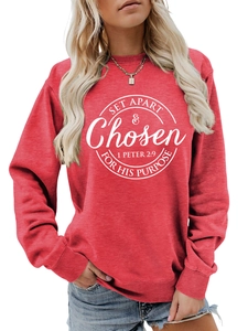 Close-up of red crewneck sweatshirt featuring white SET APART & CHOSEN printed design