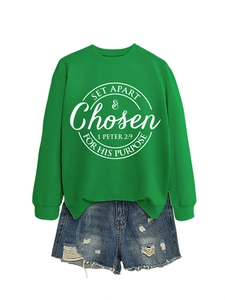 Detail of green crewneck sweatshirt with white Bible verse print and denim shorts set