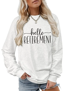 Close-up of Hello Retirement print and ribbed cuffs on white cotton sweatshirt