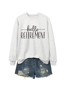 Close-up of hello RETIREMENT printed sweatshirt and distressed denim shorts set