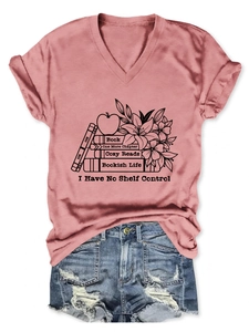 Detail of V-neck T-shirt featuring artistic book and lily flower print on soft fabric