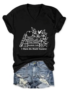 Close-up of black V-neck T-shirt with white bookish art print and lily flower detail