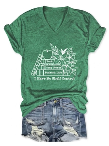 Flat lay of green V-neck T-shirt with bookish life floral print and denim shorts