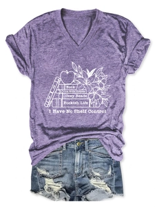 Detail of purple V-neck t-shirt with bookish graphic print and denim shorts