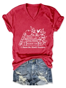 Close-up of red V-neck T-shirt featuring creative book and lily floral graphic print