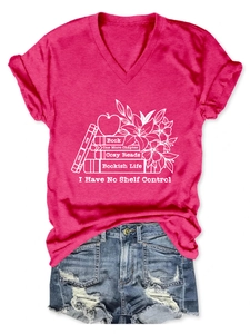Flat lay of a rose red V-neck T-shirt with white bookish life graphic and denim shorts