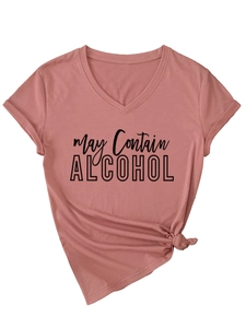 Close-up of May Contain Alcohol text on dusty pink V-neck T-shirt with front knot detail