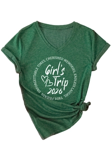 Detail of green V-neck T-shirt with Girl's Trip 2026 print and stylish knotted hem