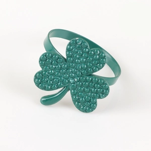 Green shamrock napkin ring with clover shape and textured finish for table setting