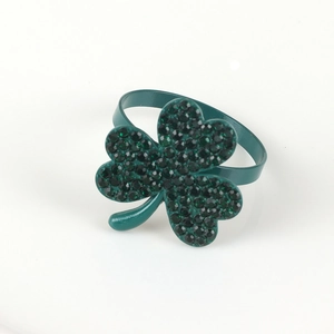 Detail shot of green clover napkin ring featuring sparkling rhinestones and enamel finish