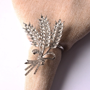 Detailed close-up of a silver wheat ear napkin ring with sparkling crystal rhinestones