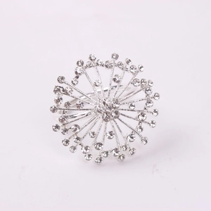 Silver starburst napkin ring with rhinestone crystals for elegant wedding table settings