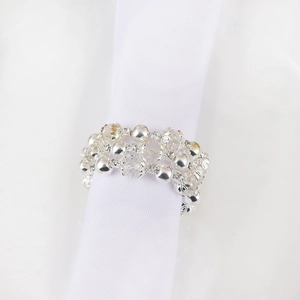 Elegant napkin ring featuring silver beads and clear faceted crystals for wedding decor