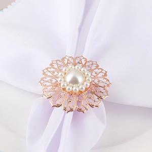 Rose gold hollow flower napkin ring with large central pearl and surrounding gems