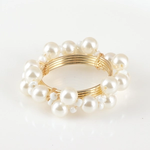Elegant gold wire woven napkin ring with pearls for wedding and table decoration