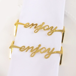 Golden Enjoy metal napkin rings in hollow lettering for elegant table decoration