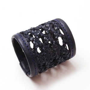 Handmade navy leather woven napkin ring with blue stitching for table setting decor