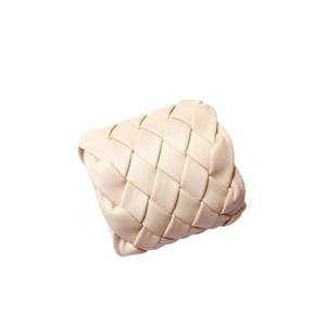 Handwoven beige leather napkin ring with textured weave for creative table settings