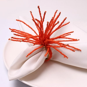 Handmade orange beaded napkin ring in coral style for wedding and banquet table decor