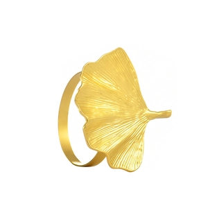 Elegant gold ginkgo leaf napkin ring with detailed vein textures for hotel table settings