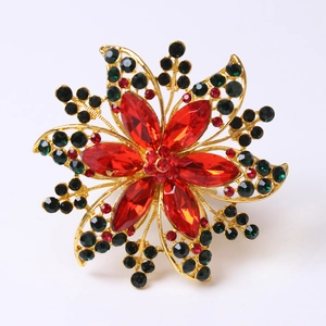 Rond de serviette fleur de Noël avec strass rouges et verts sur socle doré