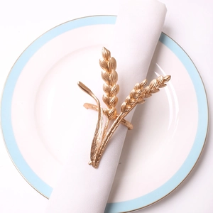 Elegant gold wheat ear napkin ring made of metal for dining table decor and hotel setting