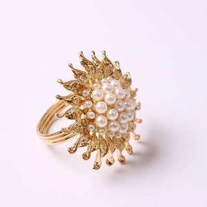 Golden sunflower napkin ring with pearl petals for elegant hotel table decoration