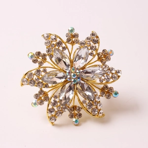 Elegant gold metal flower napkin ring with sparkling crystals for wedding table decor