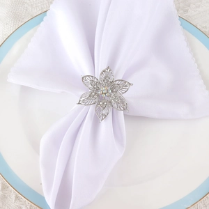 Elegant silver floral napkin ring with hollow petals and sparkling rhinestone accents