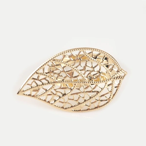 Hollow leaf napkin ring in golden finish with intricate metallic mesh pattern