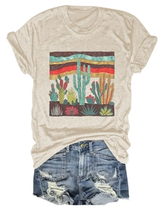 Detail of desert cactus graphic print on a beige short-sleeved t-shirt with ripped denim shorts