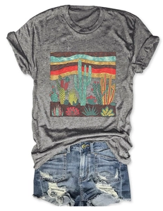 Flat lay of grey crew neck T-shirt with vintage cactus print and ripped denim shorts