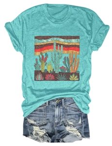 Detail of blue cactus print T-shirt and distressed denim shorts with fringe