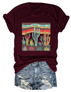 Flat lay of a wine red desert cactus print t-shirt paired with distressed denim shorts