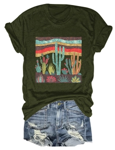 Detail of desert cactus print on dark green t-shirt paired with ripped denim shorts